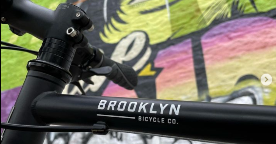 Close up of the Brooklyn Bicycle Co. logo on our Roebling hybrid bike